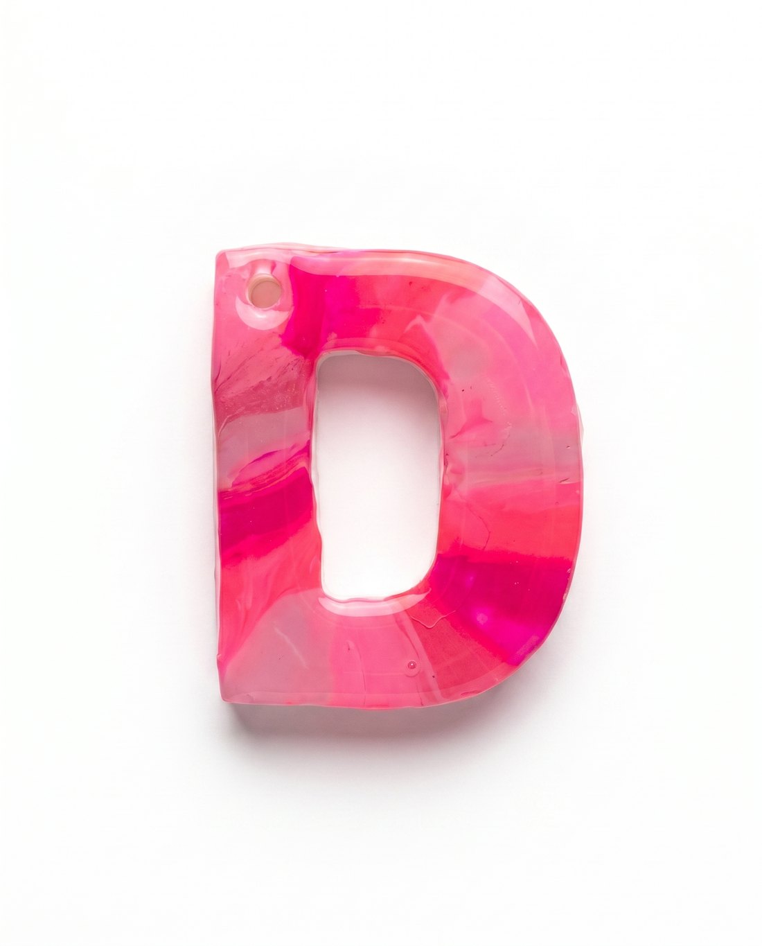 Hand-painted neon pink marble letter D charm on a white background.