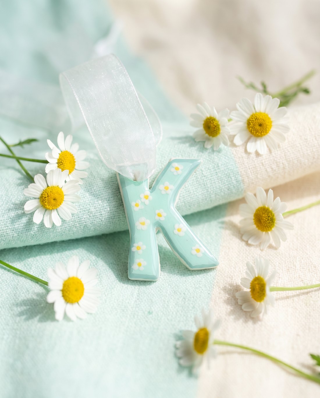 Mint green letter K charm hand-painted with little white daisies.